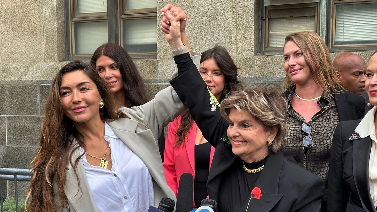 Miriam Haley and her attorney standing outside Manhattan Supreme Court.