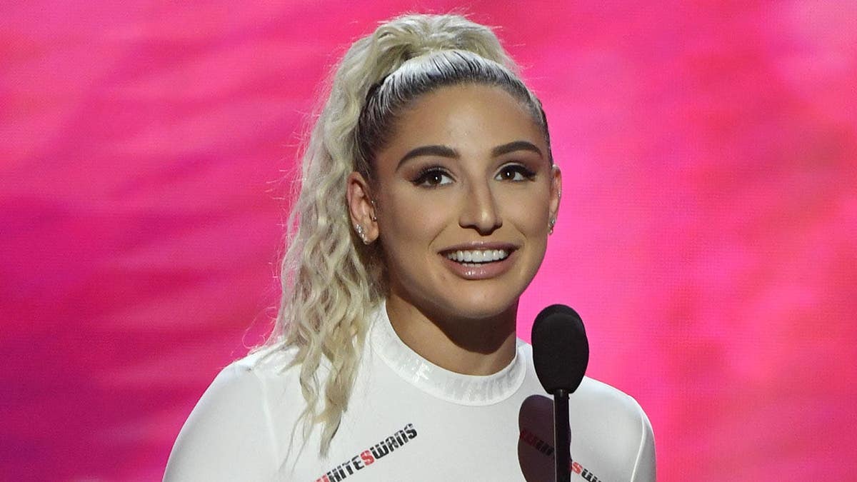 Abella Danger accepts an award onstage in Las Vegas.