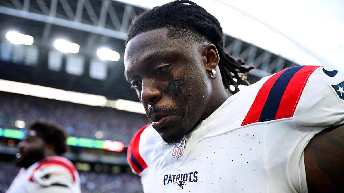 A.J. Brown looking down while walking off the football field
