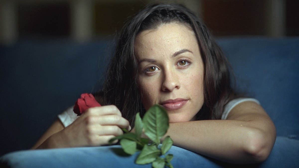 Singer Alanis Morissette in a portrait photo. Singer Alanis Morissette in a portrait photo.