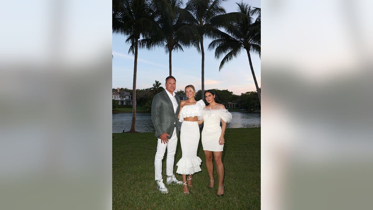 Alix Earle, Thomas TJ Earle and Ashley Alexandra Dupre stand together at a graduation celebration.