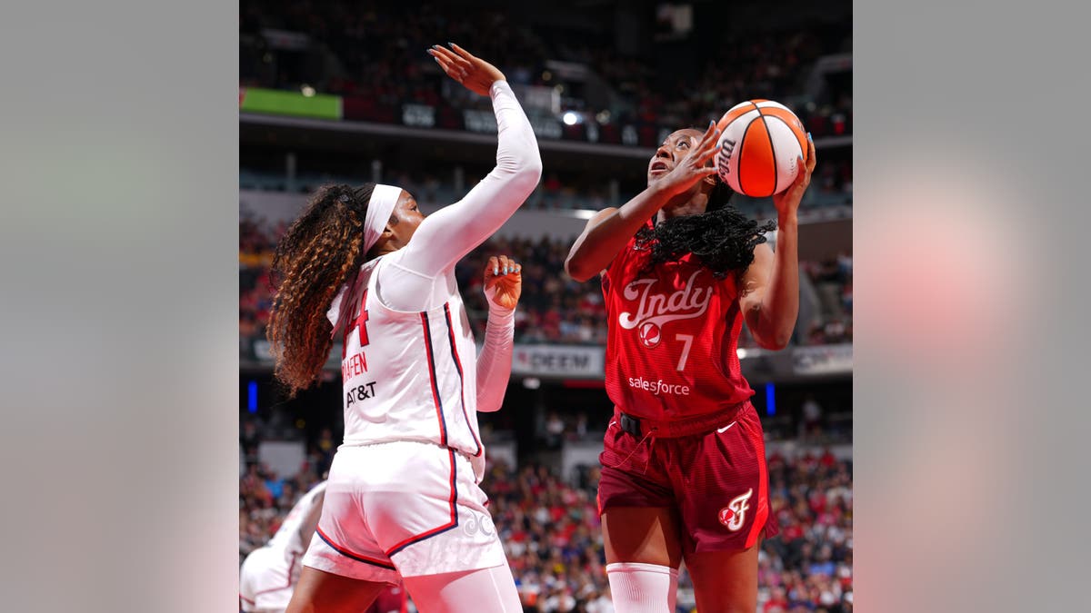Aliyah Boston drives to the basket during a game against the Washington Mystics.
