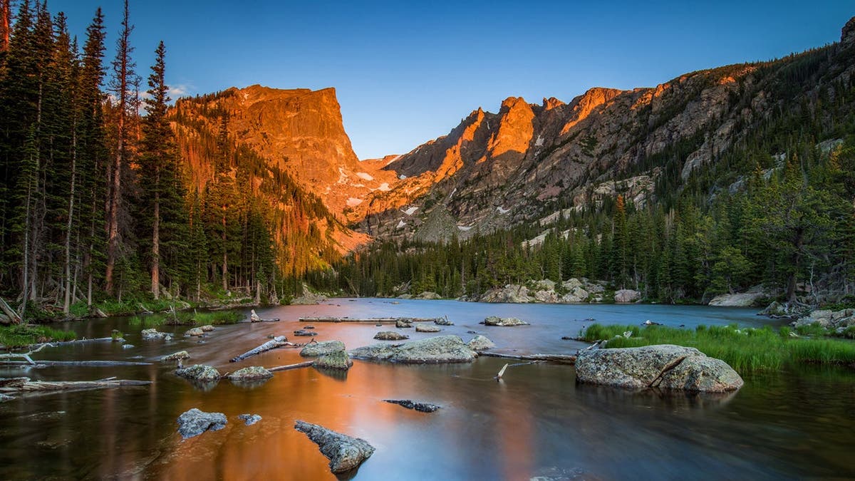 Hallet Peak glows with alpenglow in Rocky Mountain National Park.