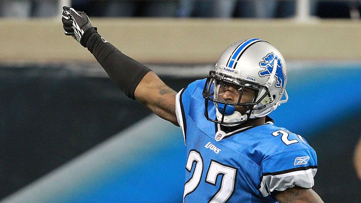 Alphonso Smith #27 scores after intercepting a pass during a Lions-Vikings game.