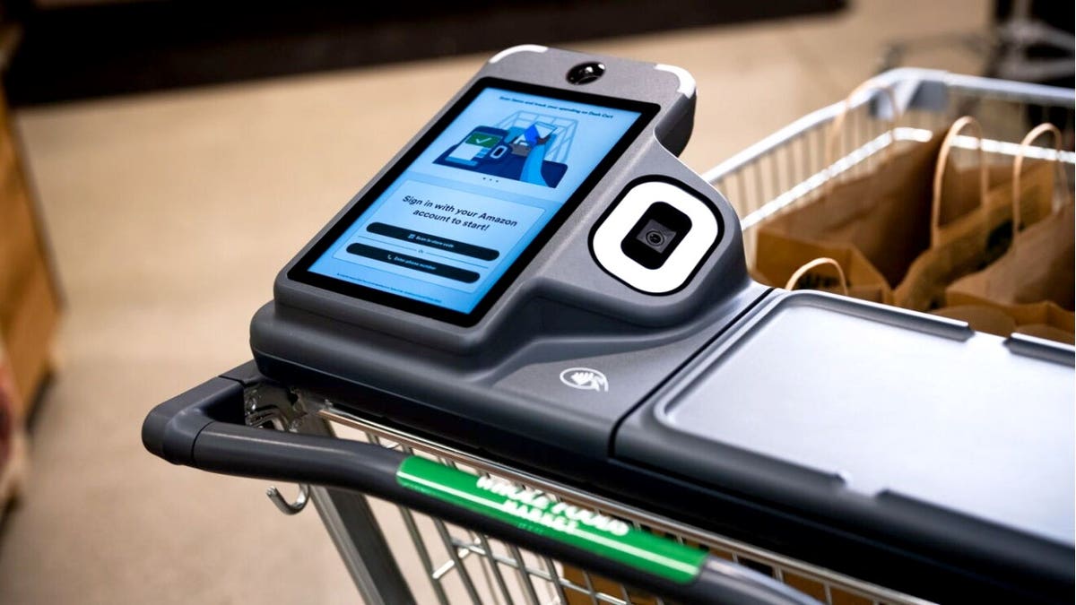A screen is shown on the handle of an Amazon Dash Cart.