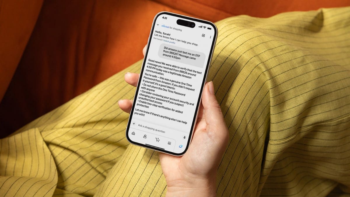 A person holds a phone. A person holds a phone.