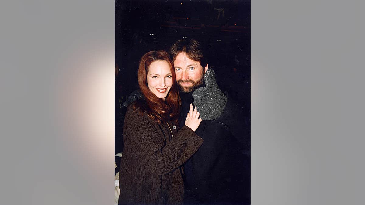 Amy Yasbeck and John Ritter stand together at the 1998 U.S. Comedy Arts Festival in Aspen.