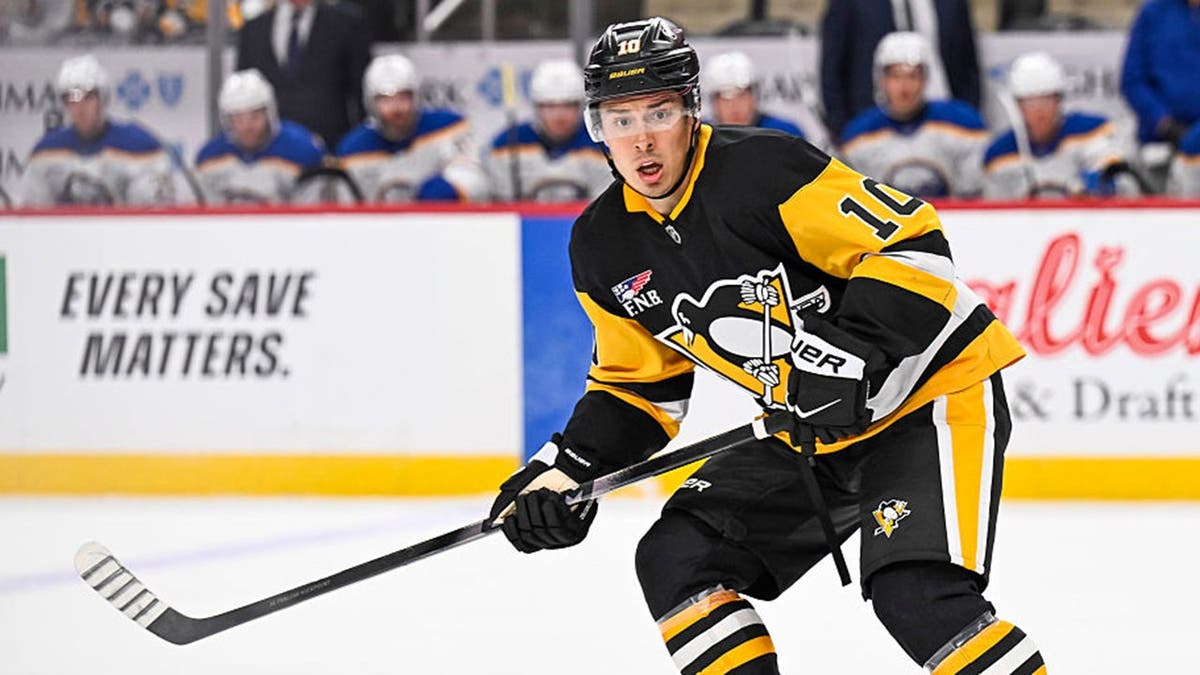 Andrei Kuzmenko skates during a preseason NHL game at PPG Paints Arena.