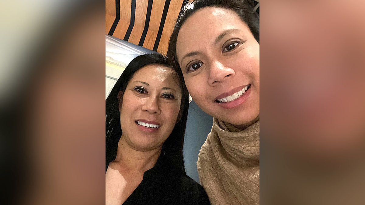 Two women smile for selfie