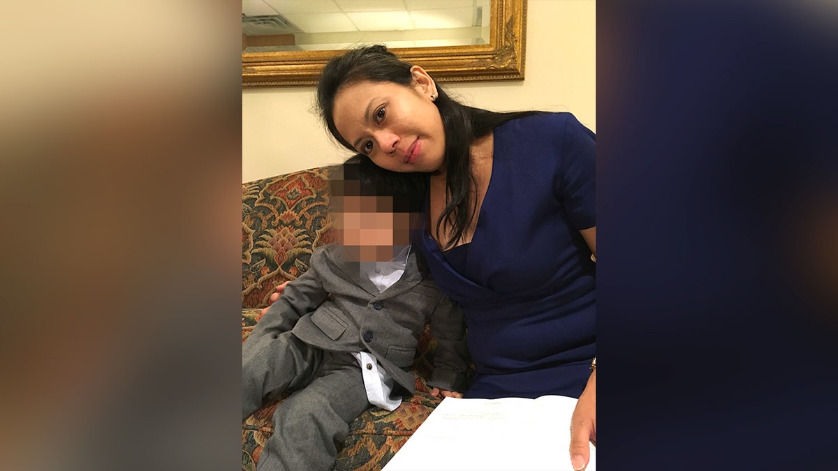 Woman sits with her son