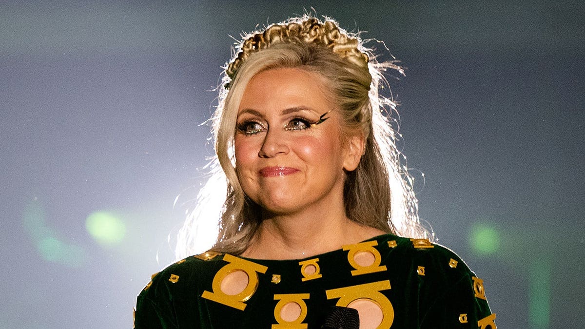Ashley Eckstein stands at The Her Universe Fashion Show 2026 in San Diego.