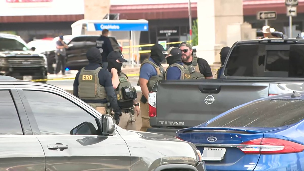 ICE agents near the scene of the shooting.