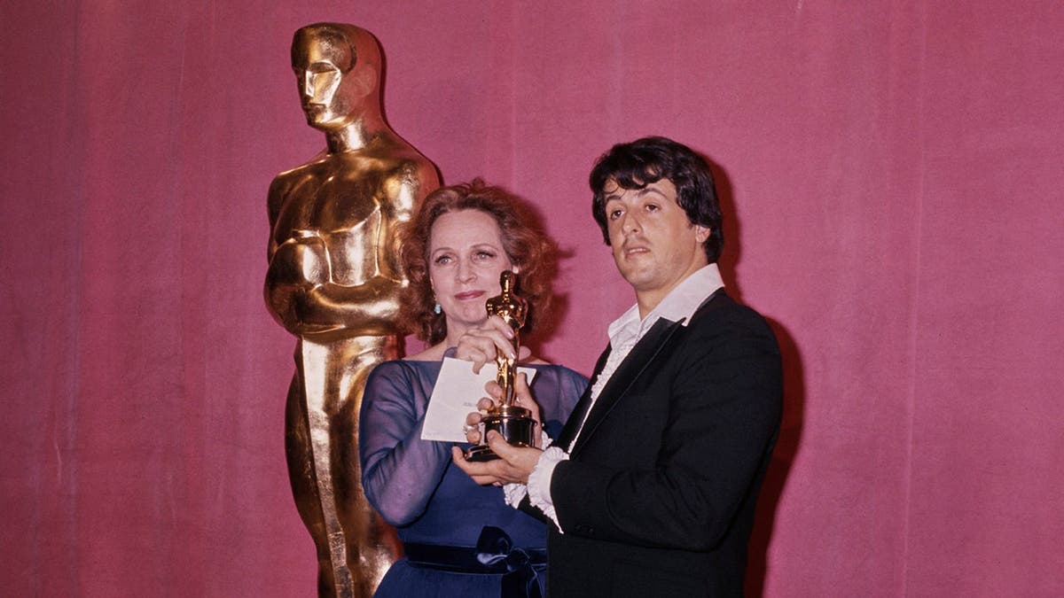 Beatrice Straight and Sylvester Stallone in the 49th Academy Awards press room.
