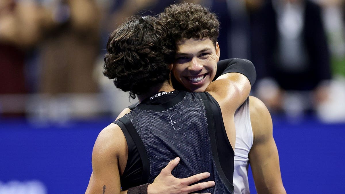 Ben Shelton is congratulated by Carlos Alcaraz after winning their U.S. Open quarterfinal match.