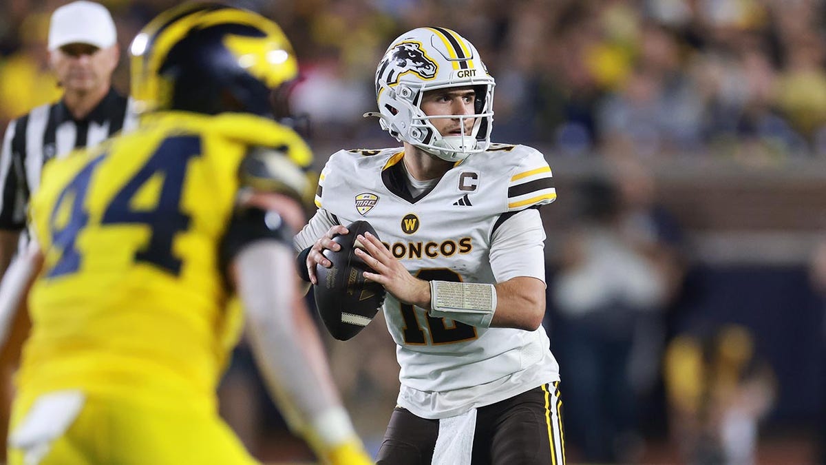 ANN ARBOR, MICHIGAN - SEPTEMBER 05: Broc Lowry #12 of the Western Michigan Broncos looks to throw a first half pass against the Michigan Wolverines at Michigan Stadium on September 05, 2026 in Ann Arbor, Michigan. (Photo by Gregory Shamus/Getty Images)