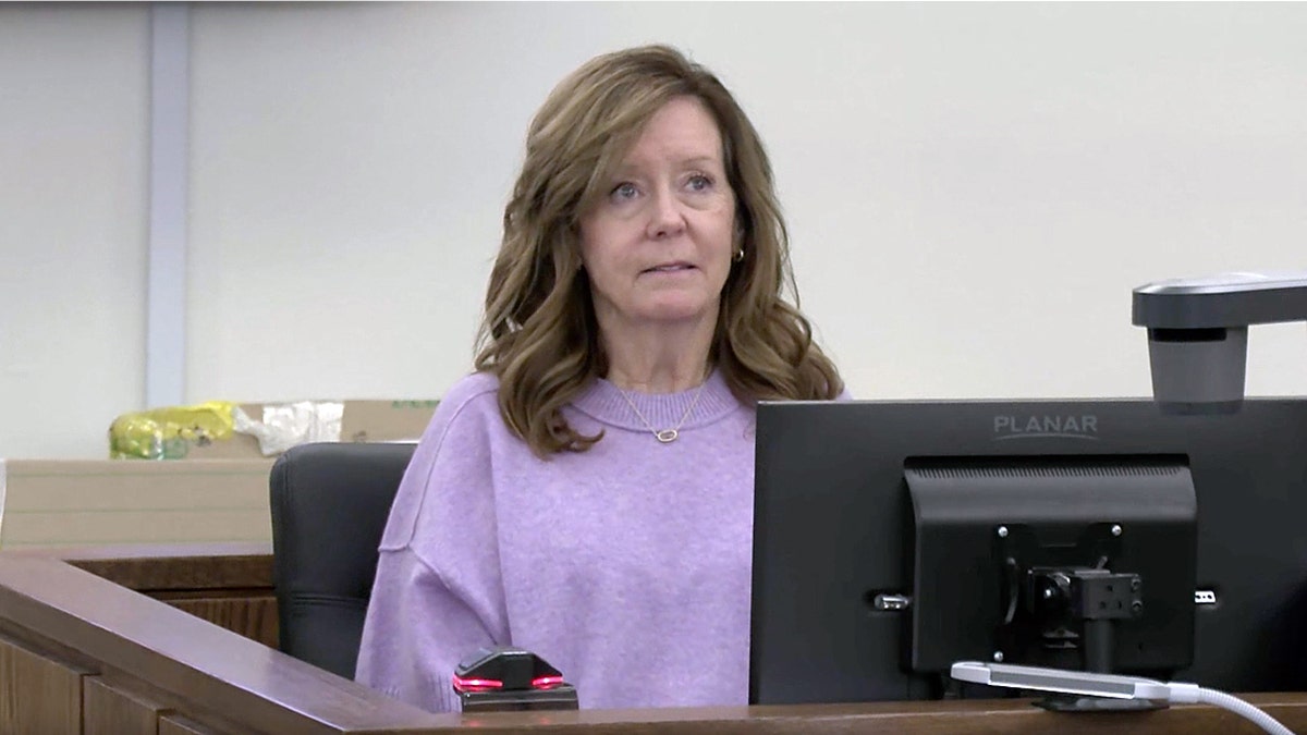 Jill Smith, the mother of Ashley Flynn, testifies from the witness stand during Caleb Flynn’s murder trial in Ohio.