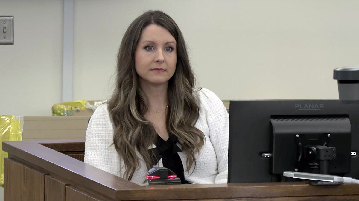 Kayla Keyt, the sister of Ashley Flynn, testifies from the witness stand during Caleb Flynn’s murder trial in Ohio.