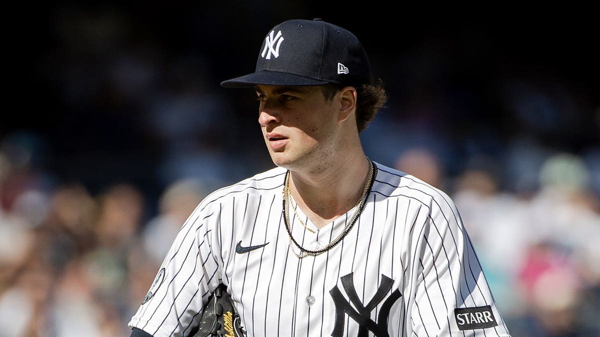 Cam Schlittler prepares to throw during a baseball game in New York.