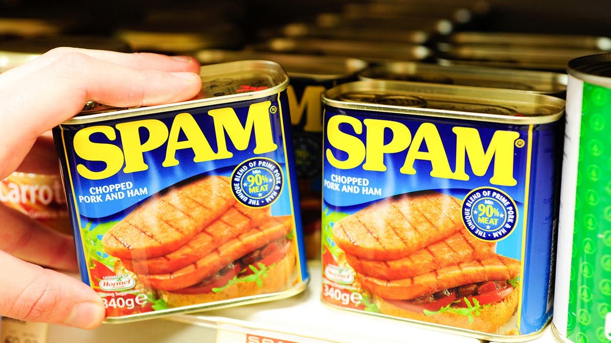 Spam cans displayed on a shelf.