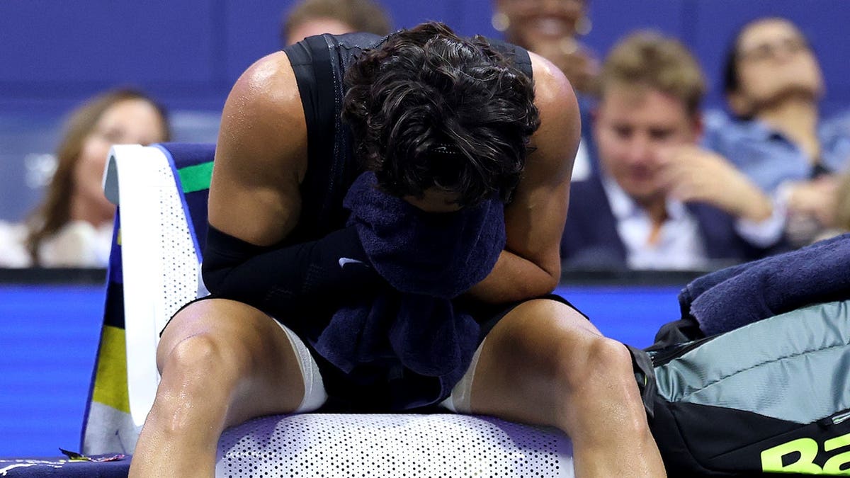 Carlos Alcaraz of Spain appears sick during his U.S. Open quarterfinal match against Ben Shelton.