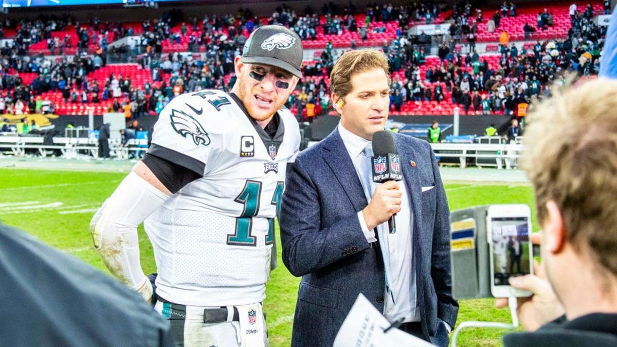Carson Wentz is interviewed by Peter Schrager at Wembley Stadium.