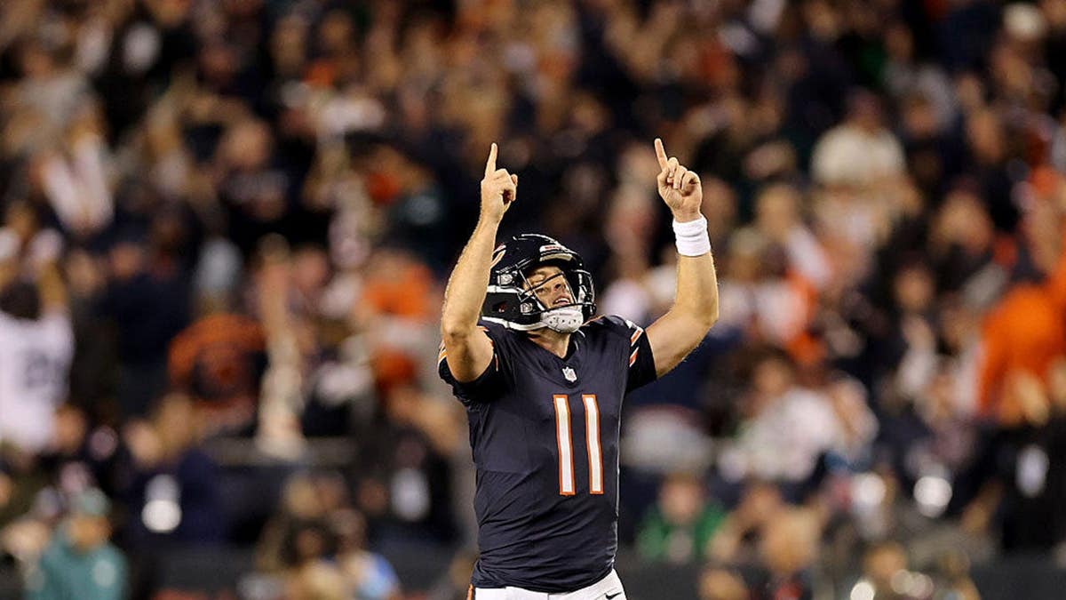 Case Keenum celebrates after Kalif Raymond scored a touchdown at Soldier Field.
