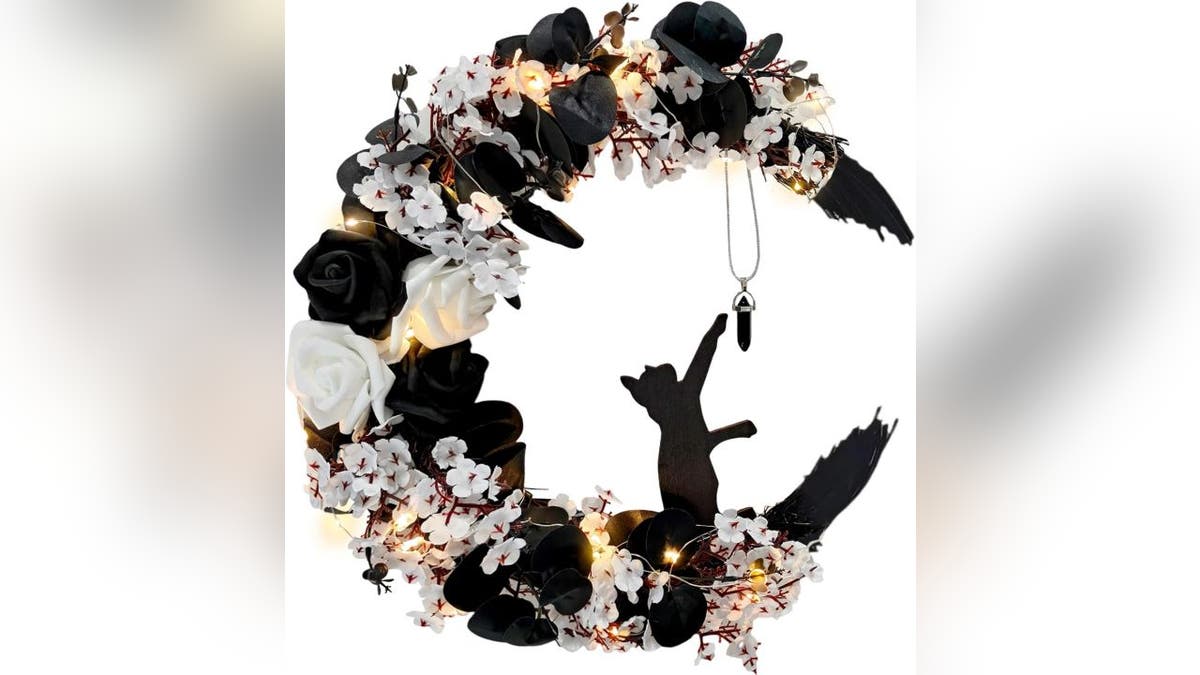 Black cat lovers can add a spooky touch with this Halloween wreath.