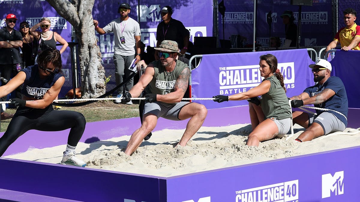 Rachel Robinson, Johnny Bananas Devenanzio, Emily Schromm and Darrell Taylor stand together at MTV event.