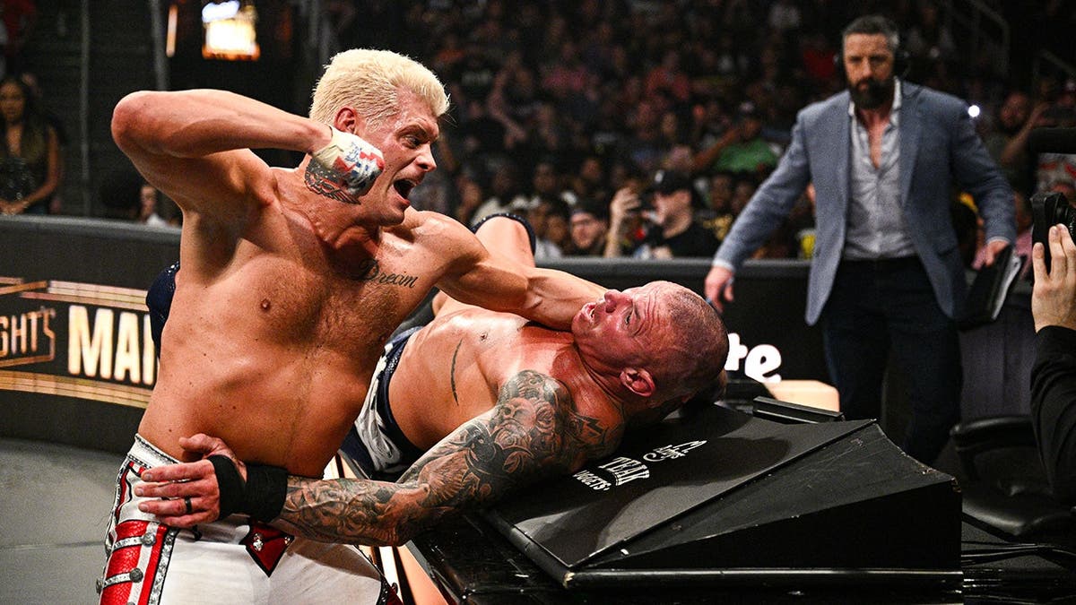 Cody Rhodes in action against Randy Orton during a wrestling match at State Farm Arena.