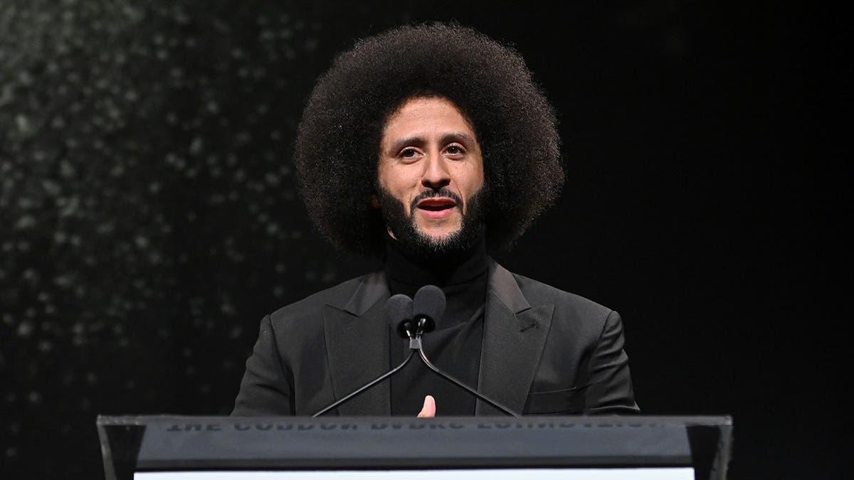 Colin Kaepernick speaks onstage during an awards dinner in New York City.