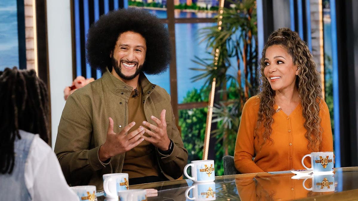 Colin Kaepernick sits with Sunny Hostin on The View set.