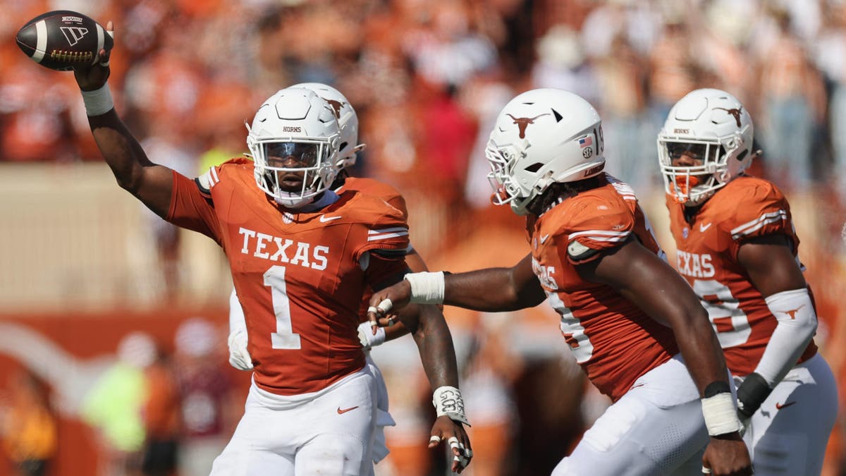 Colin Simmons celebrates after a turnover during a Texas Longhorns game.
