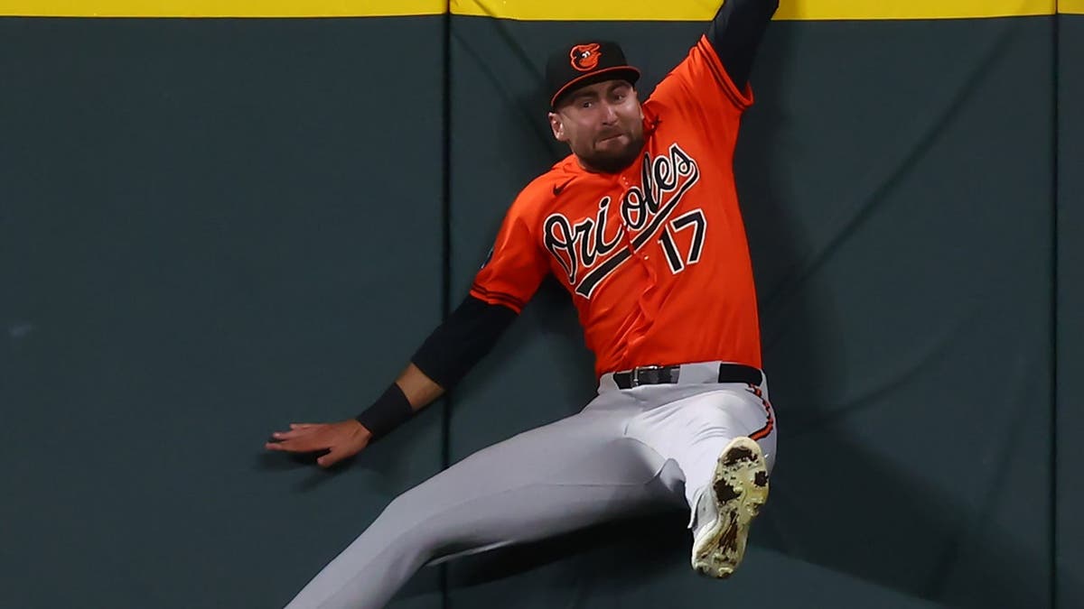 Colton Cowser of the Baltimore Orioles celebrates after robbing a home run at Coors Field.