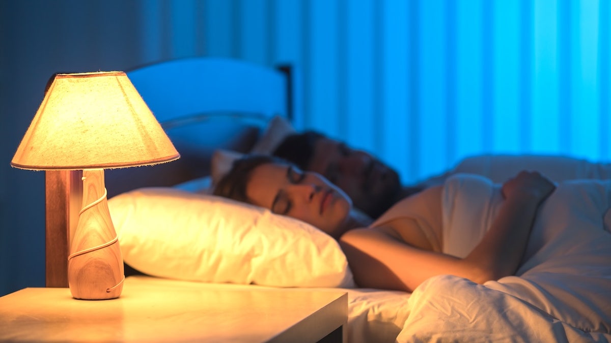 Couple sleeping with nightlight