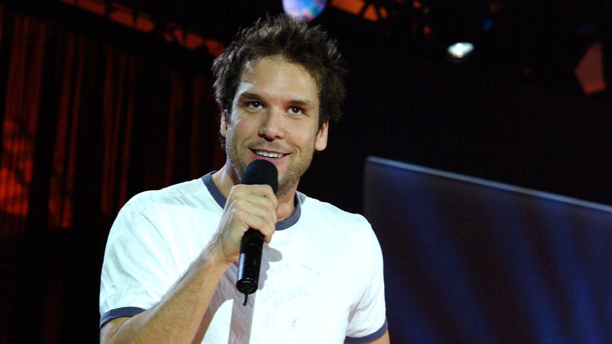 Dane Cook performs on stage