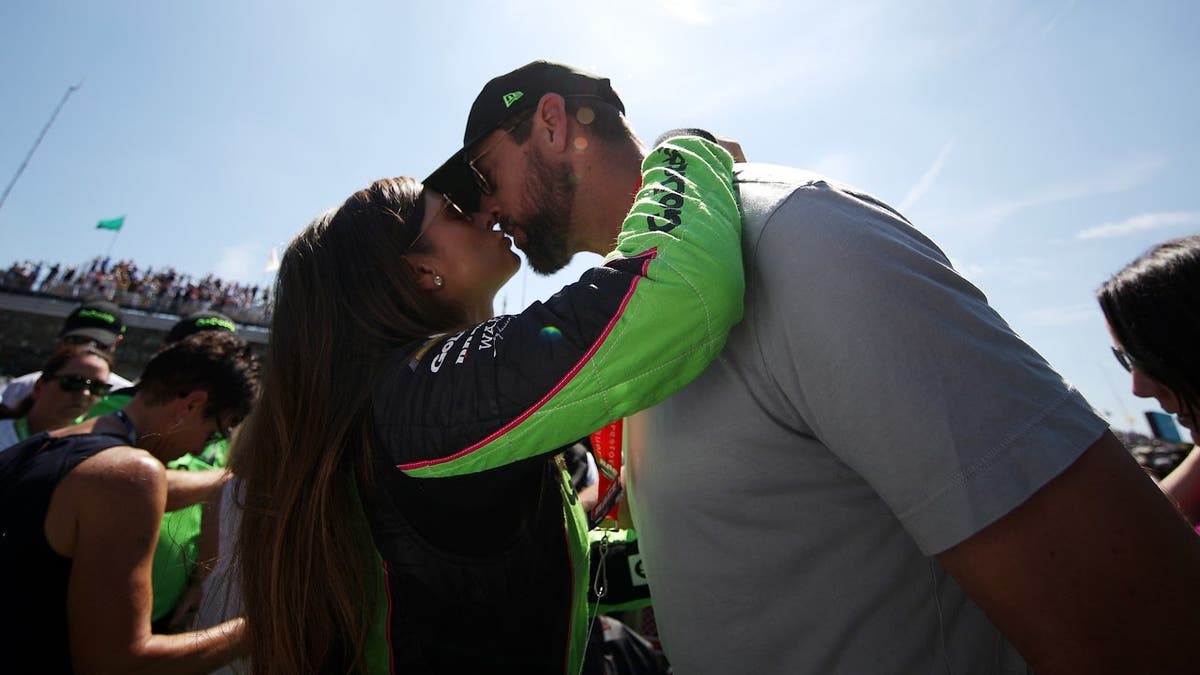 Danica Patrick kisses Aaron Rodgers before the Indianapolis 500.