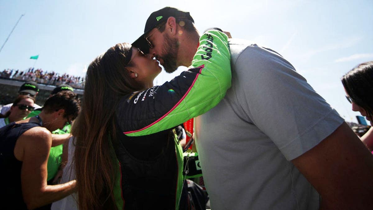 Danica Patrick kisses Aaron Rodgers before the Indianapolis 500 at Indianapolis Motor Speedway. Danica Patrick kisses Aaron Rodgers before the Indianapolis 500 at Indianapolis Motor Speedway.