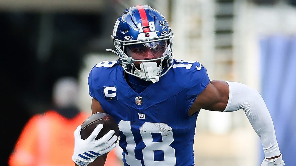 Darius Slayton #18 runs with the ball during a game at MetLife Stadium.