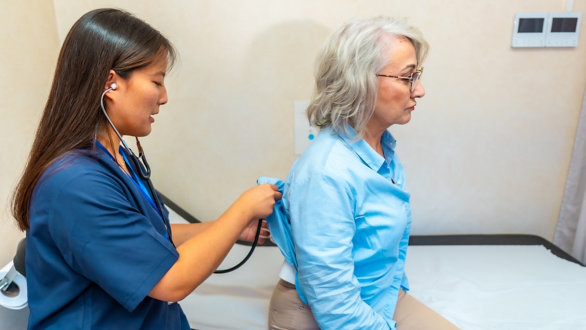 Woman getting lung exam