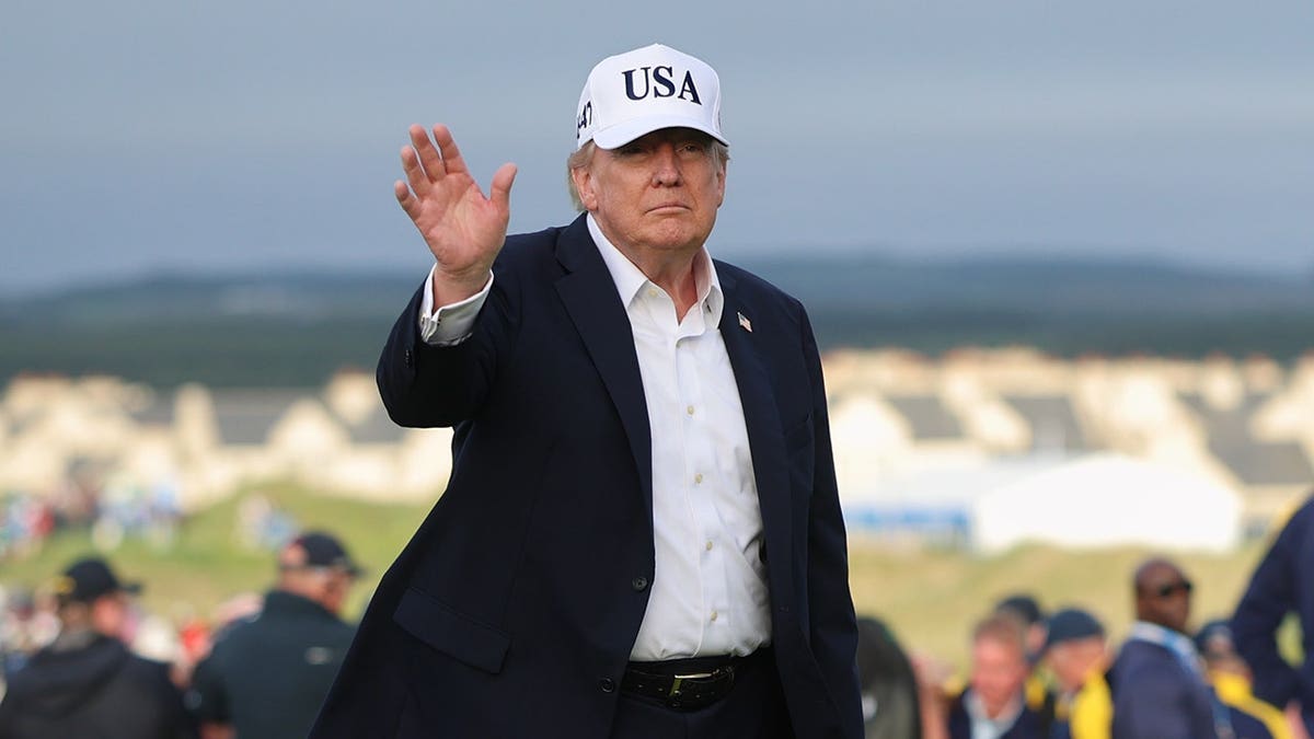 Donald Trump stands at the Irish Open in Doonbeg, Co. Clare.