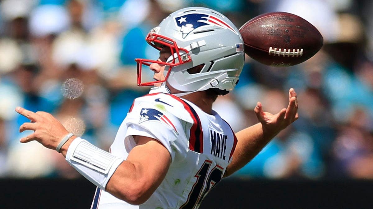 Drake Maye loses the ball on a fumble during an NFL game at EverBank Stadium.