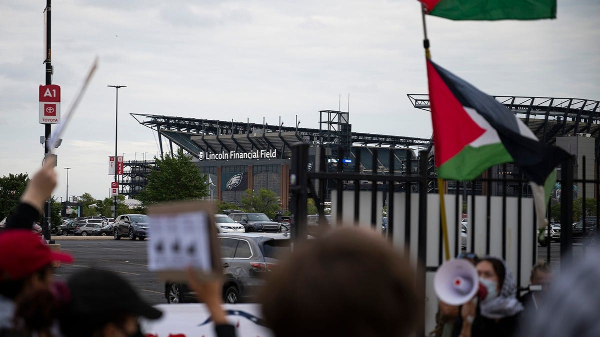 Demonstrators protest outside an Ed Sheeran concert in Philadelphia.
