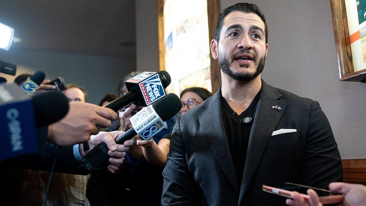Abdul El-Sayed speaks to members of the media ahead of Michigan Democratic Party convention in Lansing.