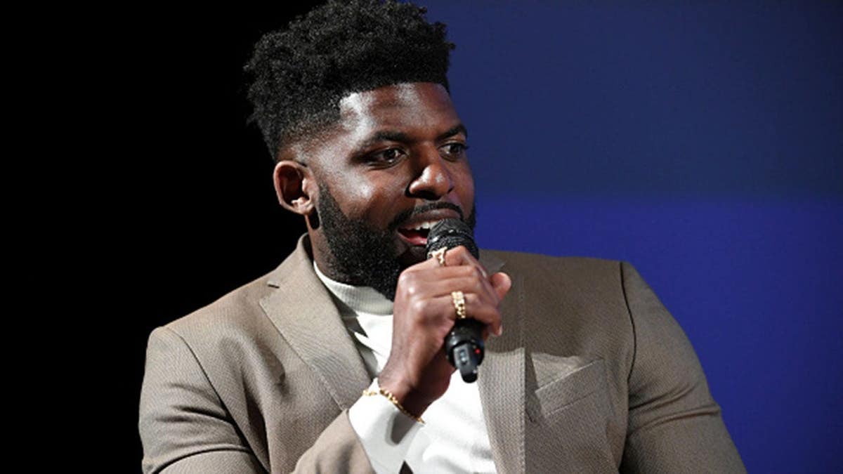 Emmanuel Acho speaks onstage during a screening event in Los Angeles.