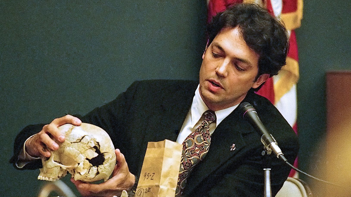Dr. Murray Marks holds the victim's shattered skull at Christa Pike's murder trial in 1996