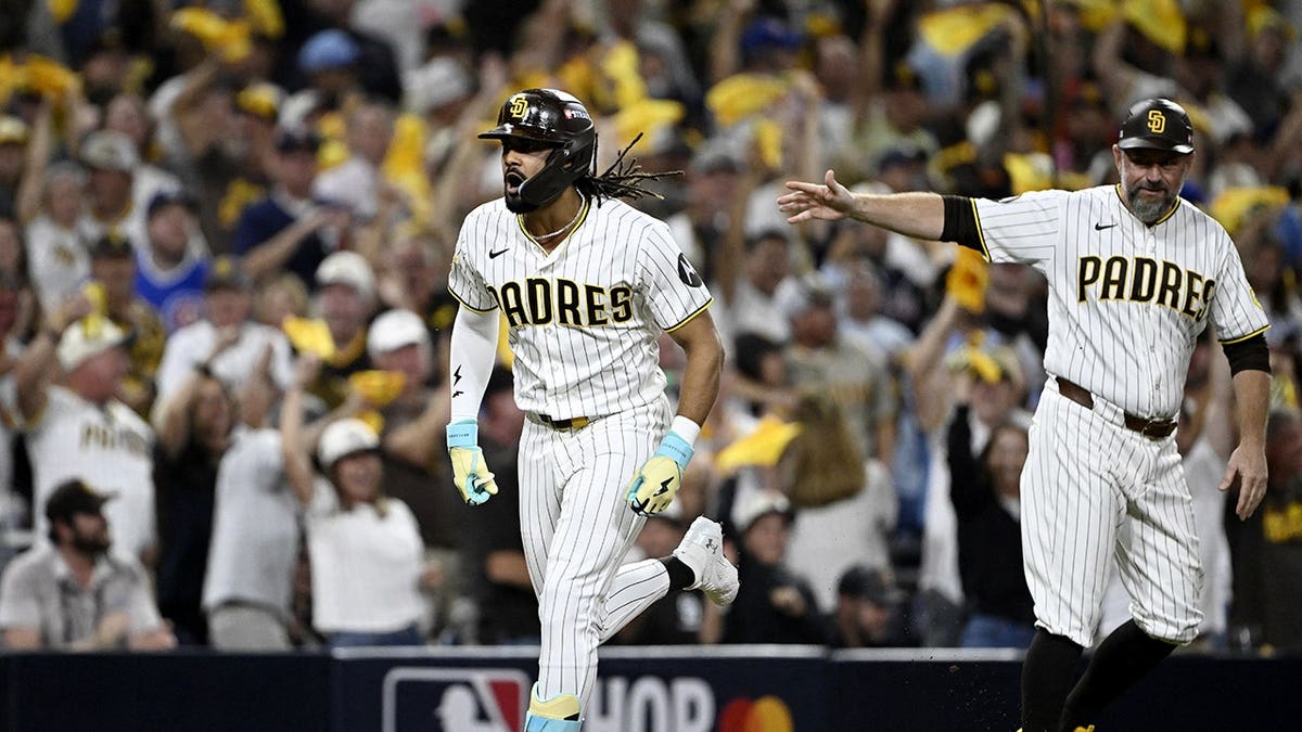 Fernando Tatis Jr. runs home after hitting a solo home run against the Chicago Cubs.