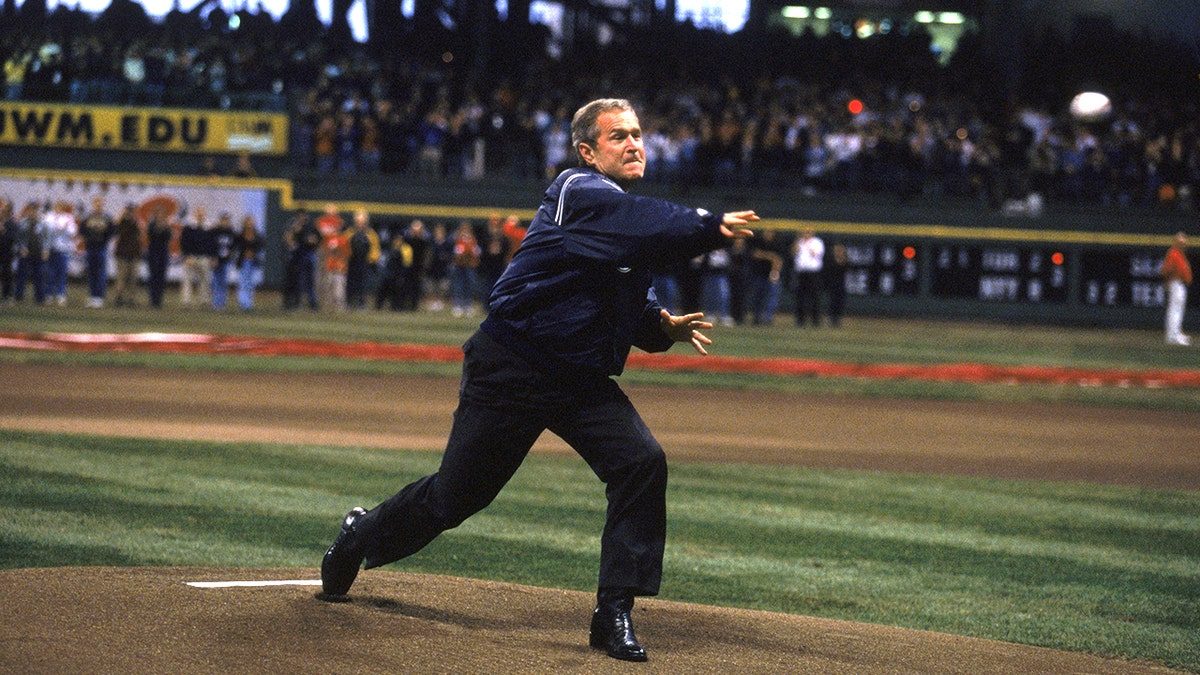 bush trhowing ball at stadium