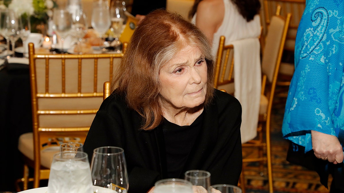 Steinem in 2025 sitting at a table at a NYC women's event