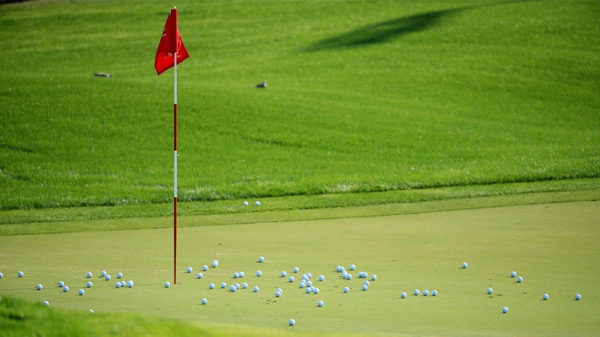 chipping green with golf balls chipping green with golf balls