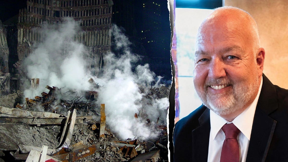 Ken Tregellas pictured next to smoking Ground Zero rubbble.
